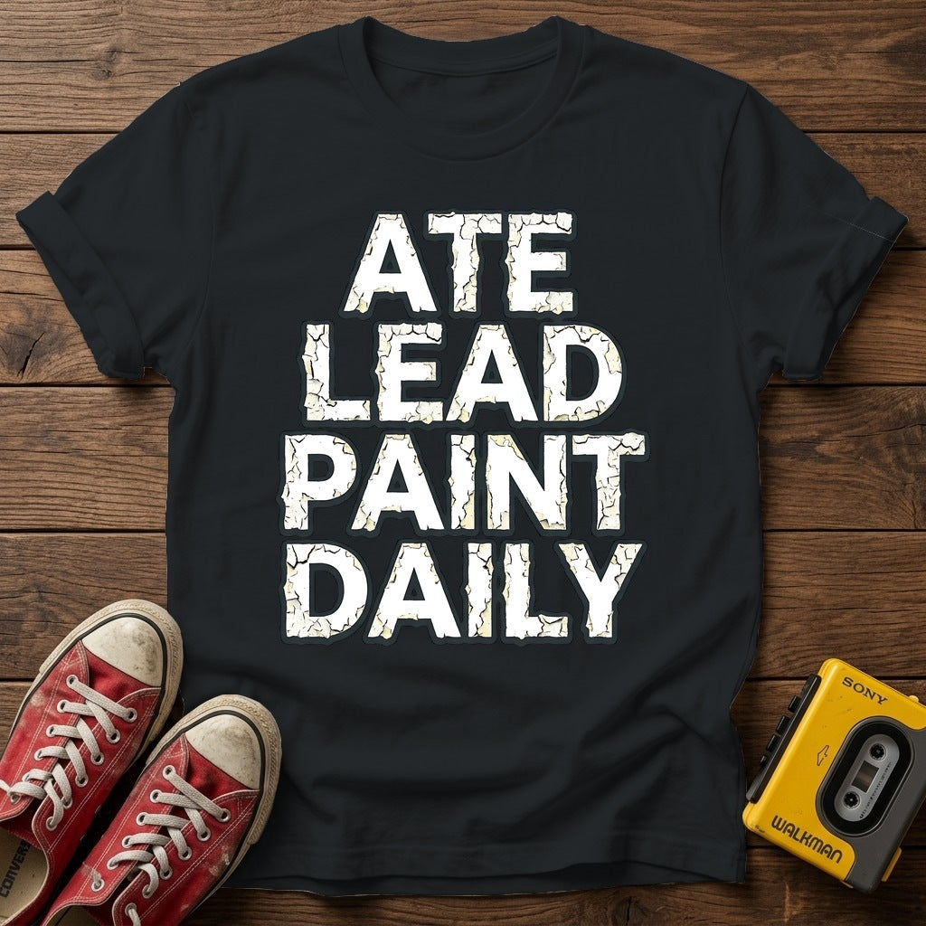 Ate Lead Paint Daily T-Shirt — Black wood flat-lay
