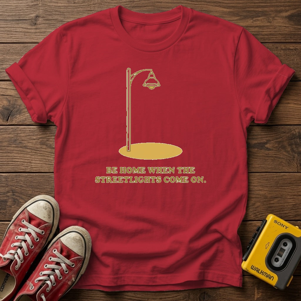 “Be Home When the Streetlights Come On”  T‑Shirt — Cherry Red wood flat-lay