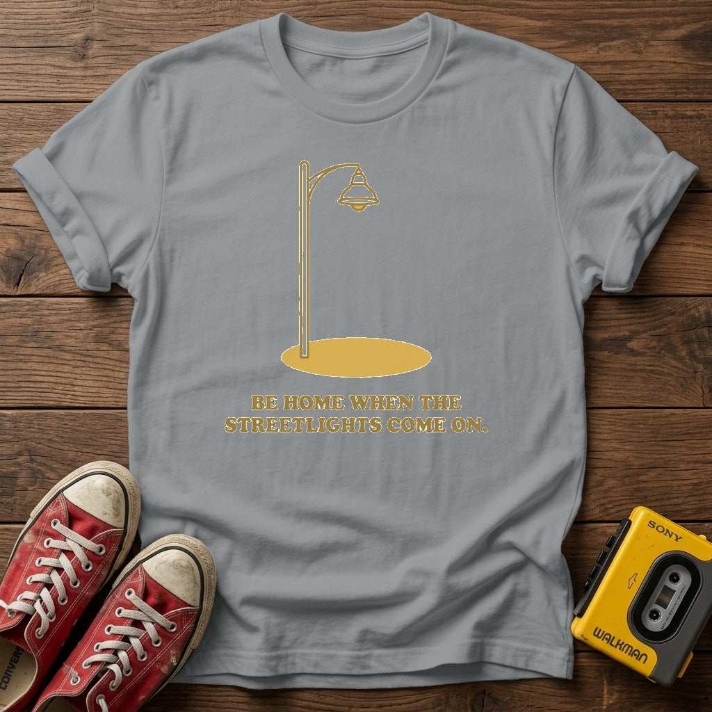 “Be Home When the Streetlights Come On”  T‑Shirt — Sport Grey wood flat-lay
