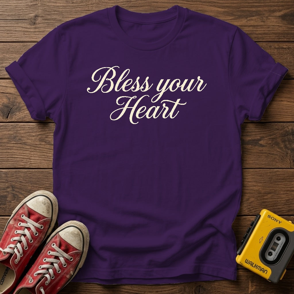 Bless Your Heart Script T-Shirt — Purple wood flat-lay