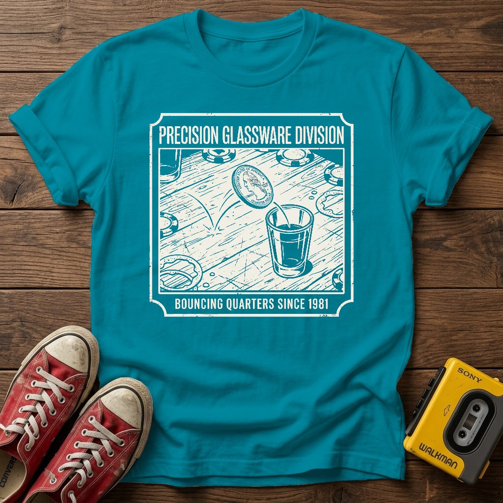 "Bouncing Quarters Since 1981" T-Shirt — Tropical Blue wood flat-lay