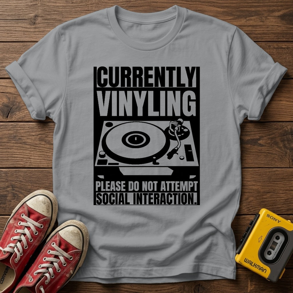 "Currently Vinyling, Please Do Not Attempt Social Interaction" T-Shirt — Sport Grey wood flat-lay
