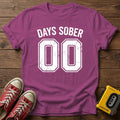 Days Sober T-Shirt — Heather Berry wood flat-lay