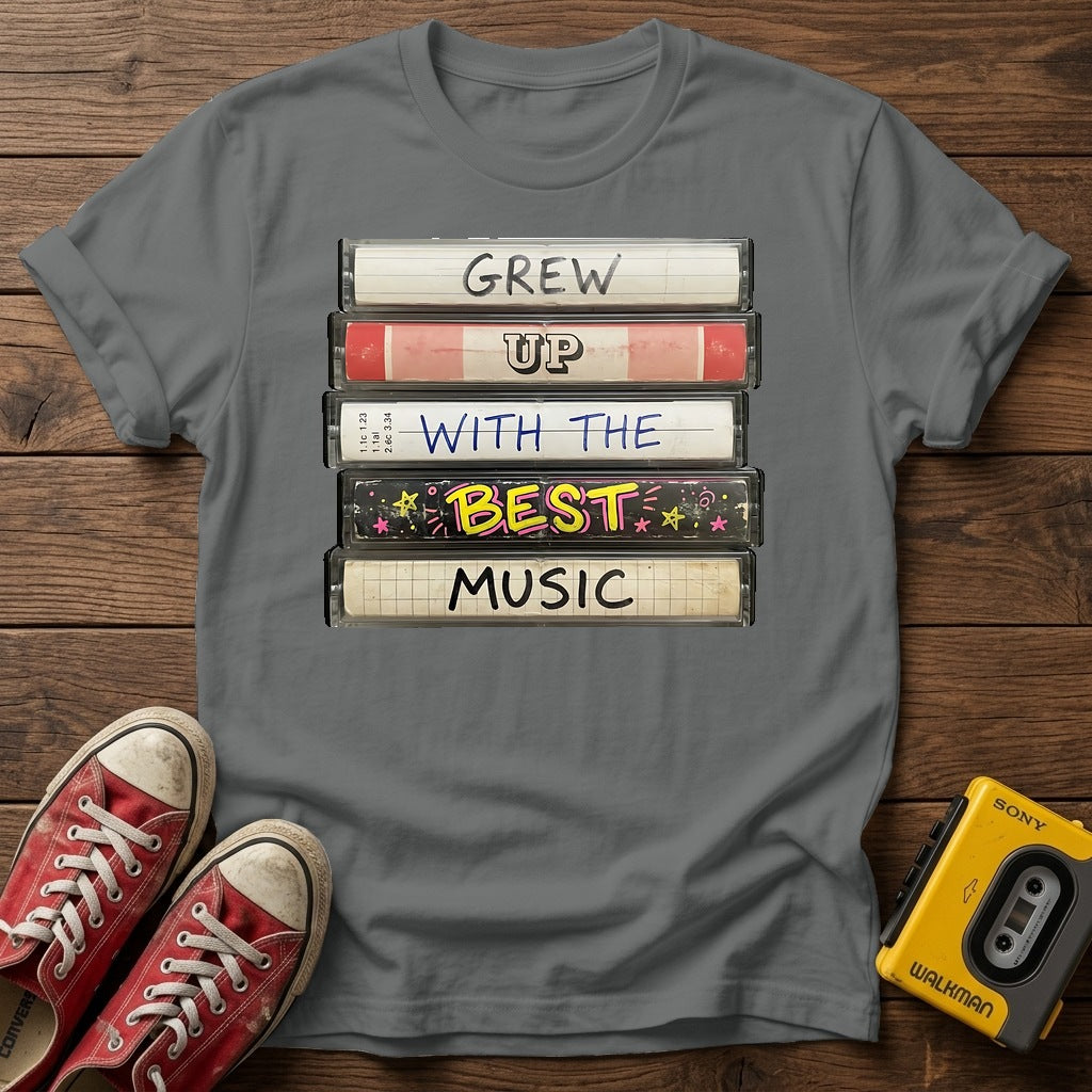 "Grew Up With The Best Music" Vintage Cassette Stack T Shirt — Graphite Heather wood flat-lay
