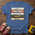 "Grew Up With The Best Music" Vintage Cassette Stack T Shirt — Heather Indigo wood flat-lay