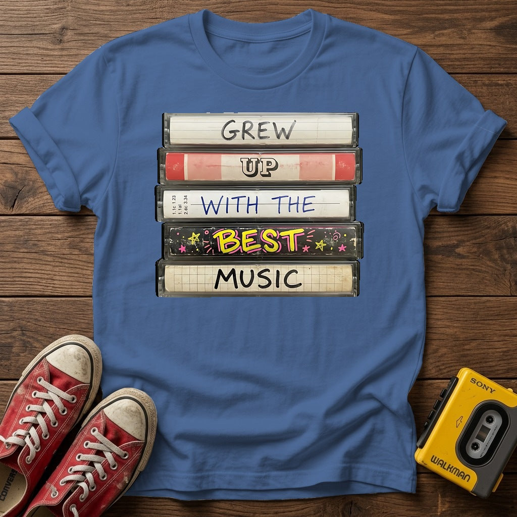 "Grew Up With The Best Music" Vintage Cassette Stack T Shirt — Heather Indigo wood flat-lay