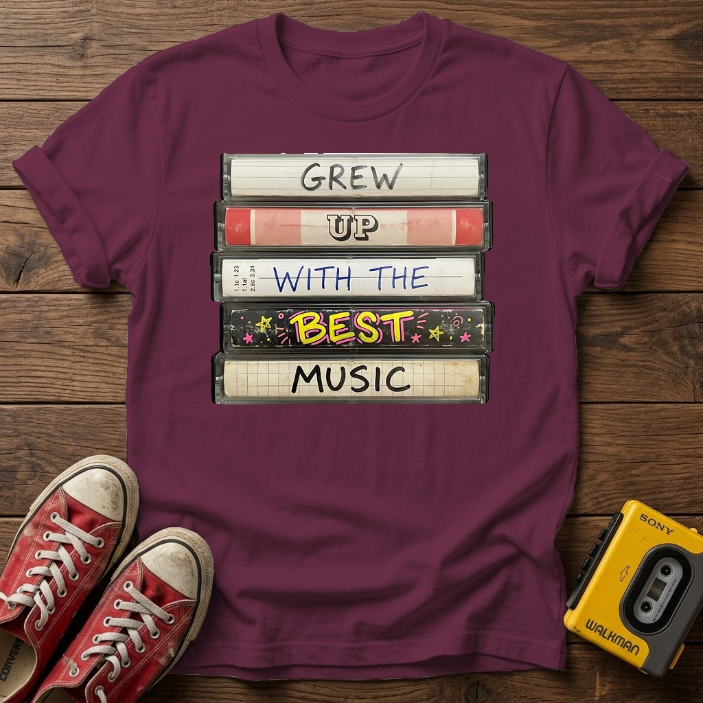 "Grew Up With The Best Music" Vintage Cassette Stack T Shirt — Heather Maroon wood flat-lay
