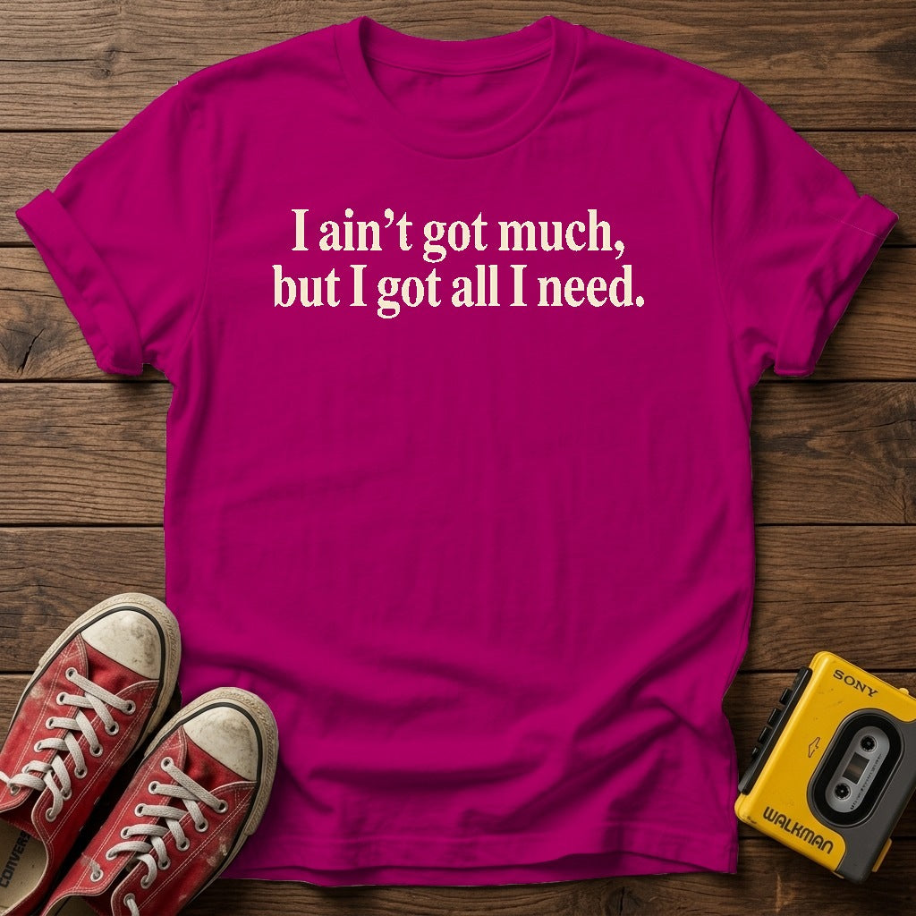 I ain’t got much, but I got all I need T-Shirt — Antique Heliconia wood flat-lay