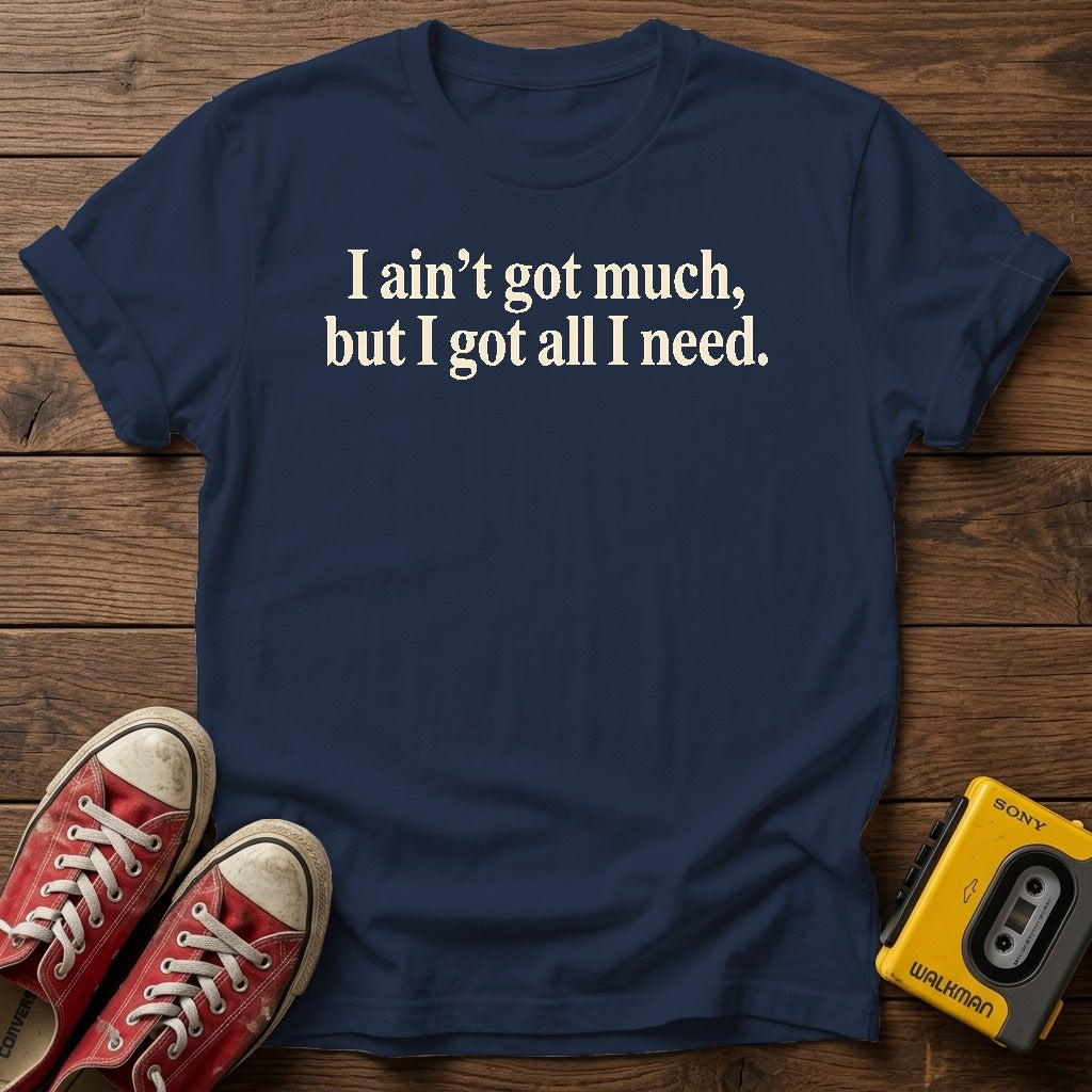I ain’t got much, but I got all I need T-Shirt — Navy wood flat-lay