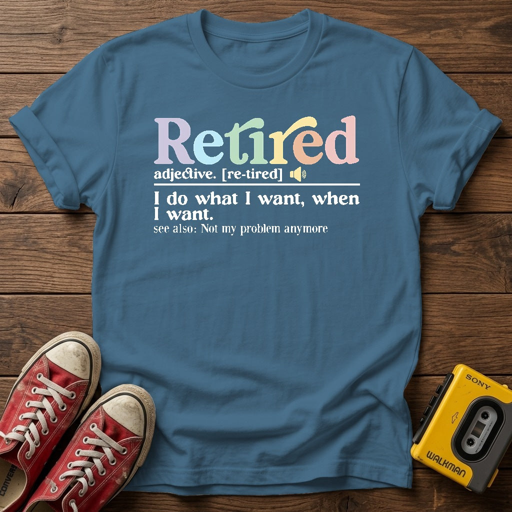 "I do what I want, when I want" Retirement T Shirt — Indigo Blue wood flat-lay