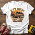 "If It's Rocking Don't Come Knocking" T Shirt — White wood flat-lay
