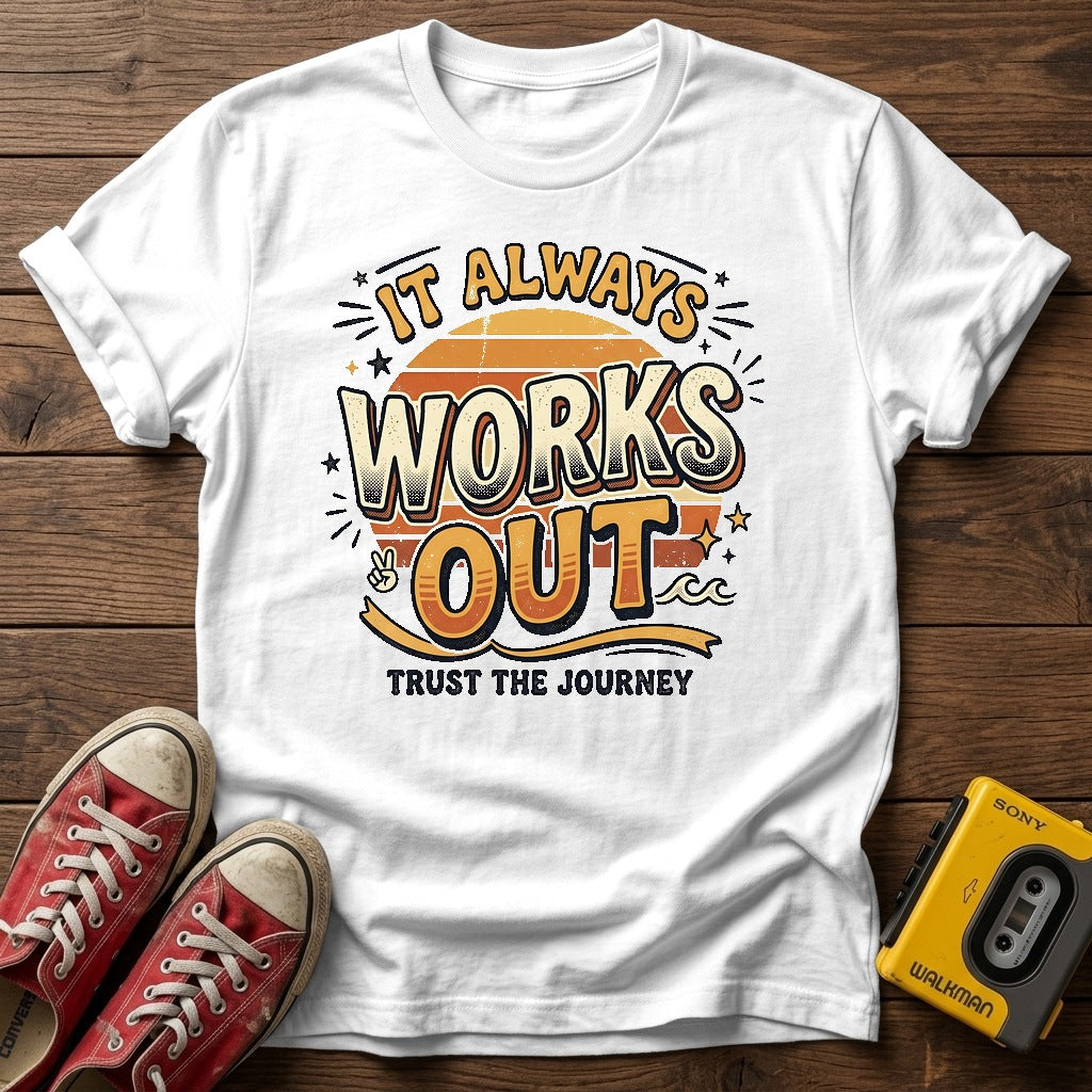 It Always Works Out  T-Shirt — White wood flat-lay