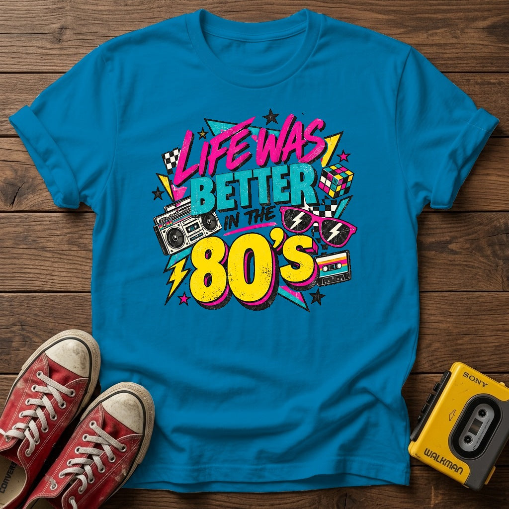 Life Was Better in the 80s T-Shirt — Heather Sapphire wood flat-lay