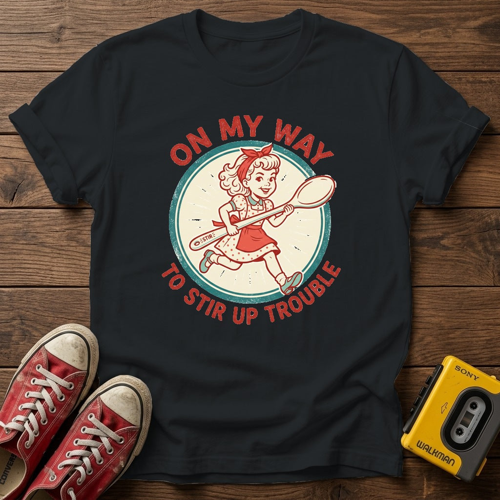 "On My Way to Stir Up Trouble" T-Shirt — Black wood flat-lay