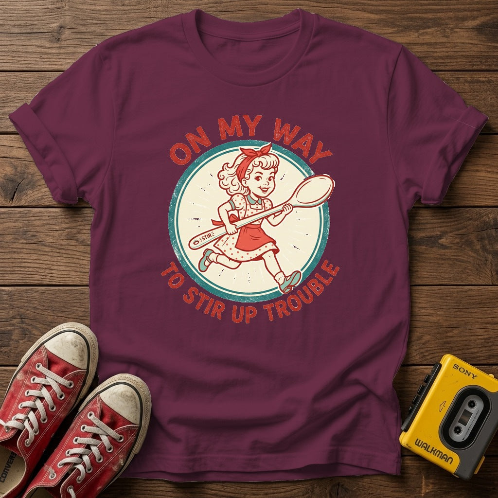 "On My Way to Stir Up Trouble" T-Shirt — Heather Maroon wood flat-lay
