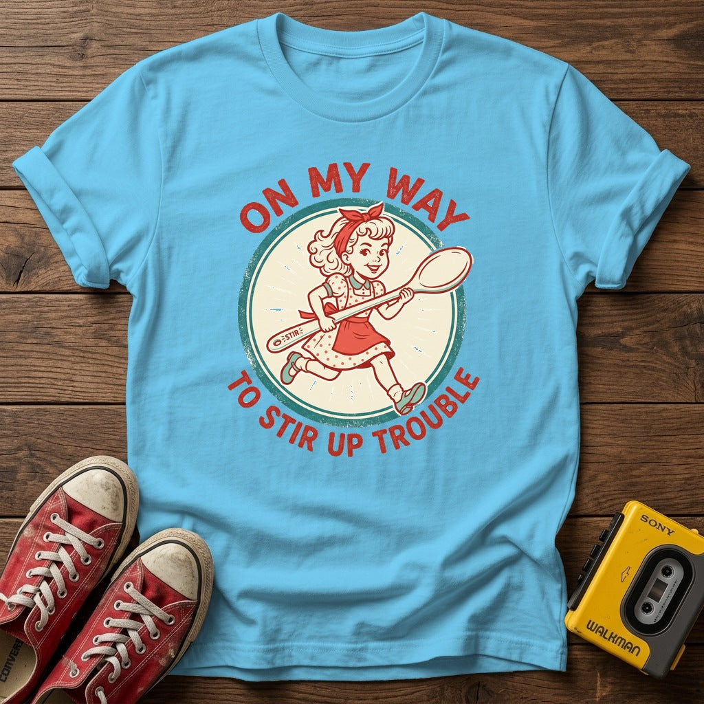 "On My Way to Stir Up Trouble" T-Shirt — Sky wood flat-lay