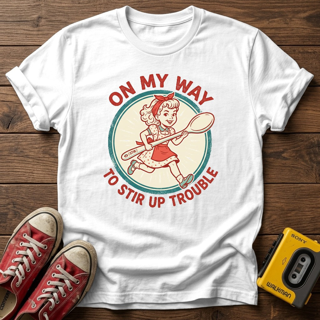 "On My Way to Stir Up Trouble" T-Shirt — White wood flat-lay