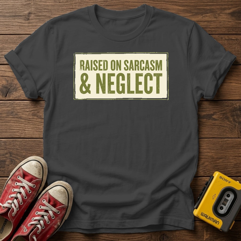 Raised on Sarcasm & Neglect T-Shirt — Dark Heather wood flat-lay