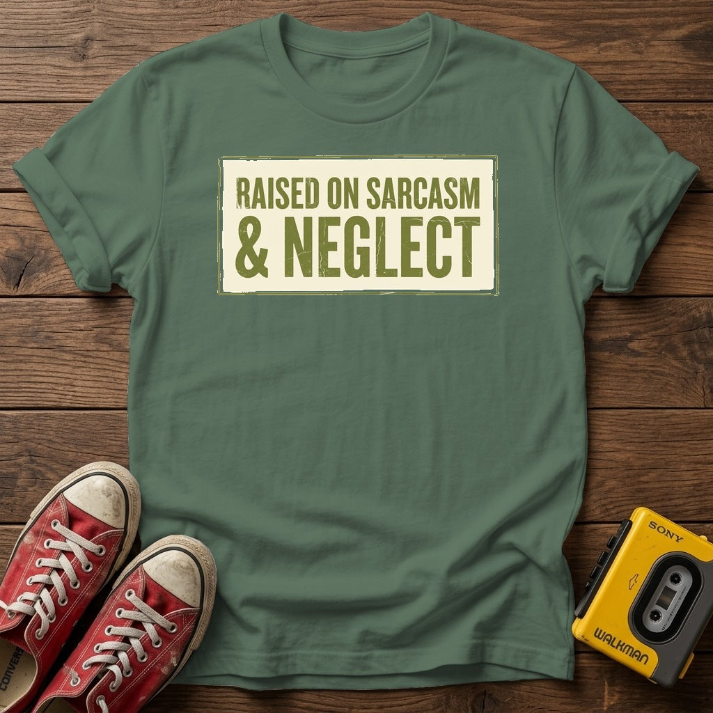 Raised on Sarcasm & Neglect T-Shirt — Military Green wood flat-lay