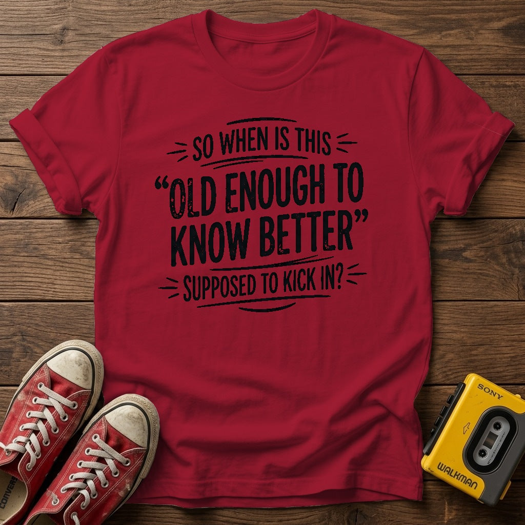 "So When Is This 'Old Enough to Know Better' Supposed to Kick In?" T Shirt — Antique Cherry Red wood flat-lay