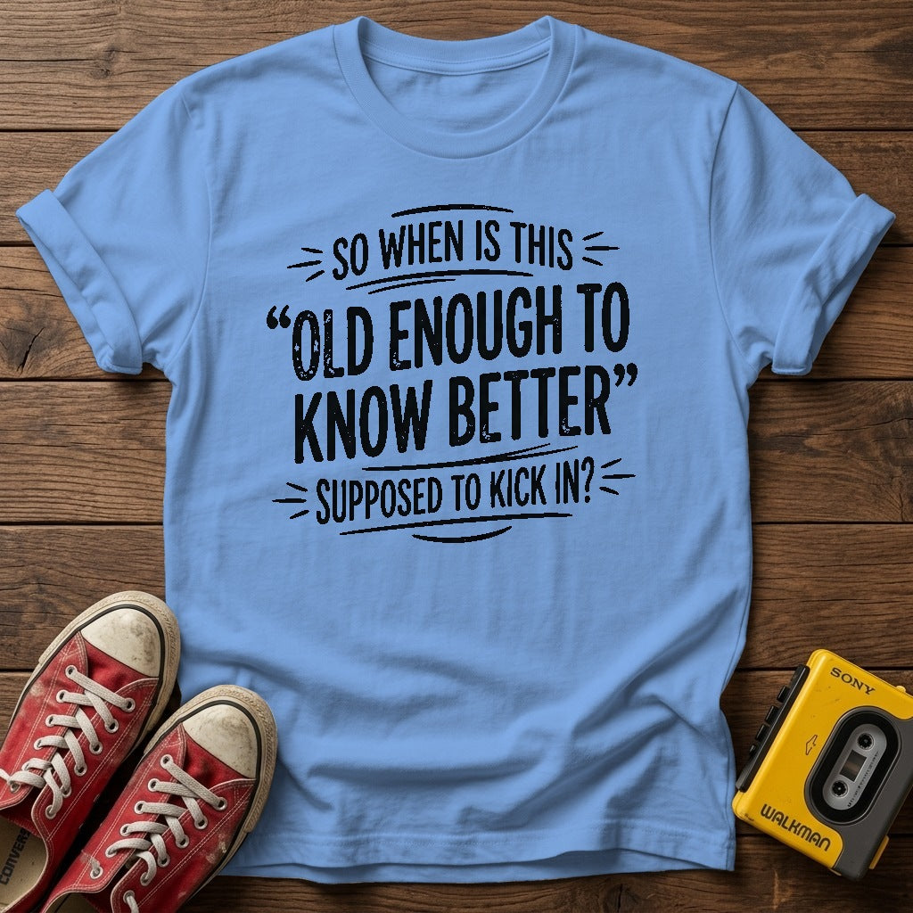 "So When Is This 'Old Enough to Know Better' Supposed to Kick In?" T Shirt — Carolina Blue wood flat-lay