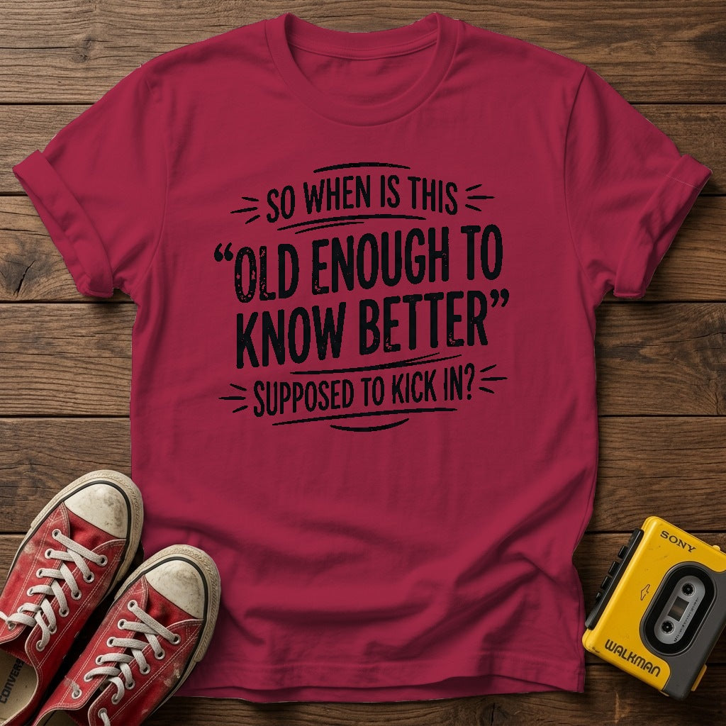"So When Is This 'Old Enough to Know Better' Supposed to Kick In?" T Shirt — Heather Cardinal wood flat-lay