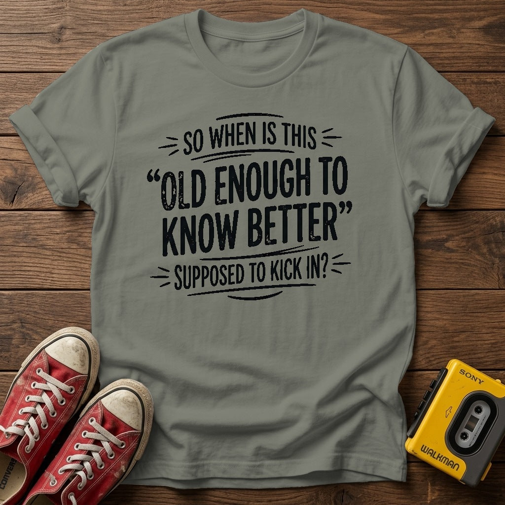 "So When Is This 'Old Enough to Know Better' Supposed to Kick In?" T Shirt — Heather Military Green wood flat-lay