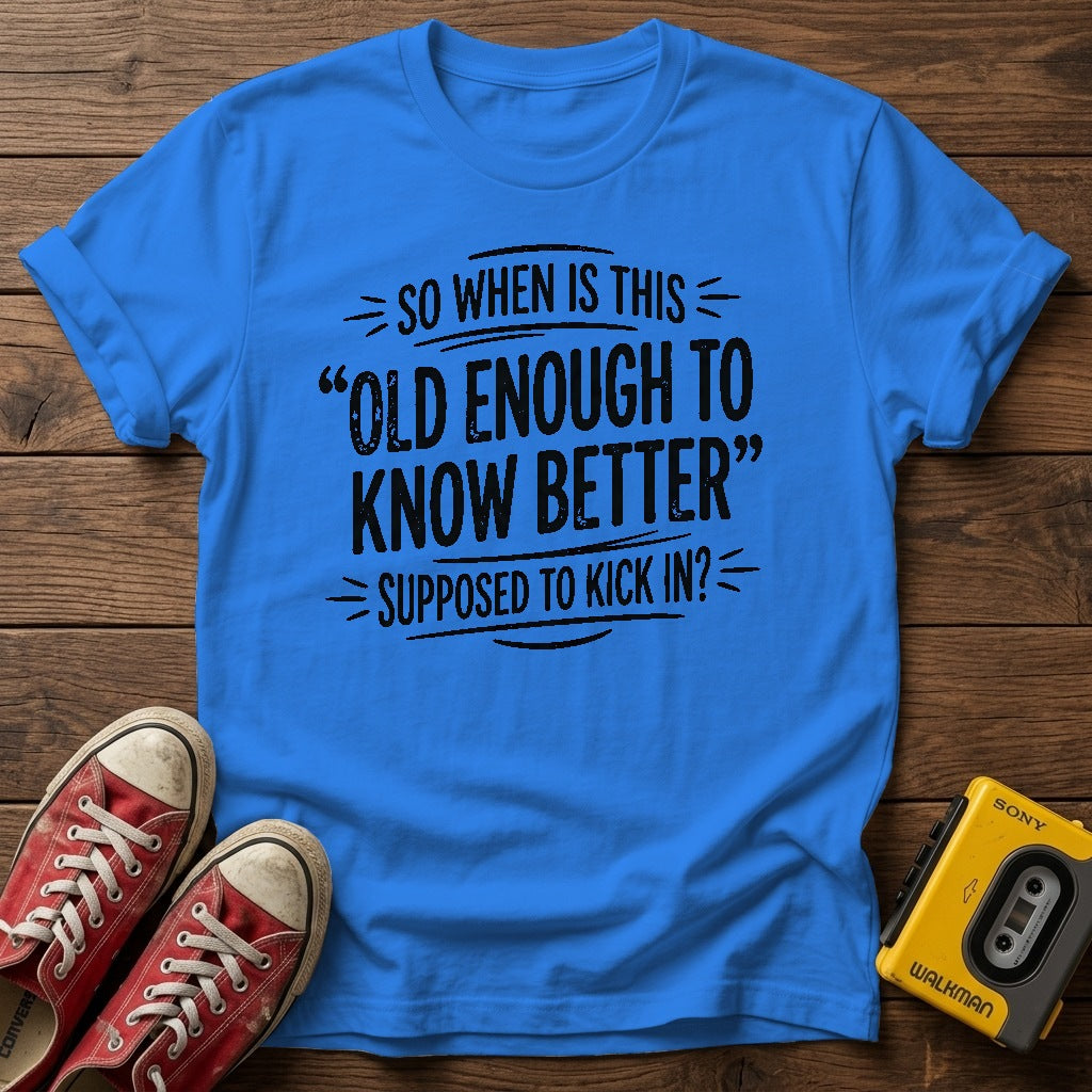 "So When Is This 'Old Enough to Know Better' Supposed to Kick In?" T Shirt — Heather Royal wood flat-lay