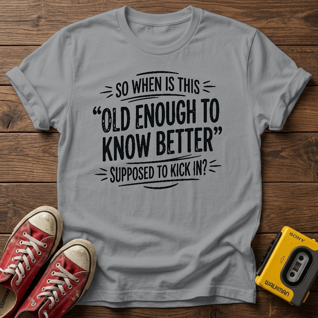 "So When Is This 'Old Enough to Know Better' Supposed to Kick In?" T Shirt — Sport Grey wood flat-lay